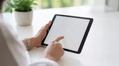 User submitting online form on tablet
