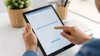 User submitting online form on tablet