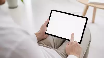 User submitting online form on tablet